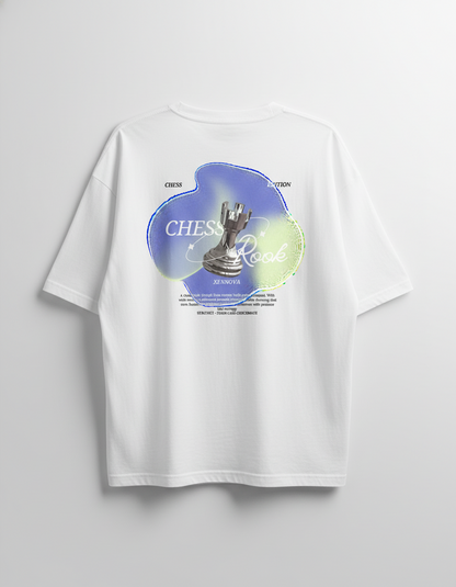 White t-shirt with a chess-themed graphic on a light gray background